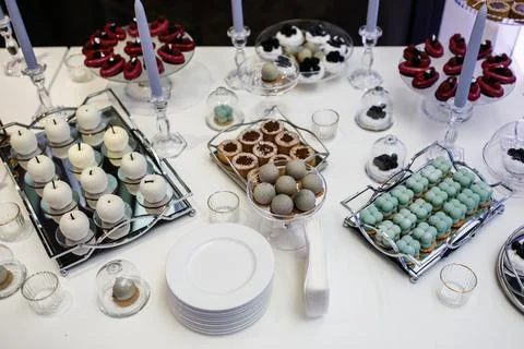 Rows of desserts on the wedding table Stock Photos