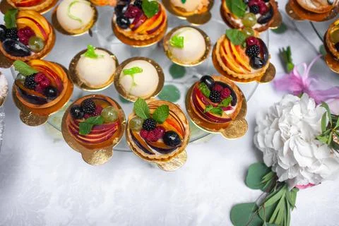 Rows of desserts on the wedding table Stock Photos