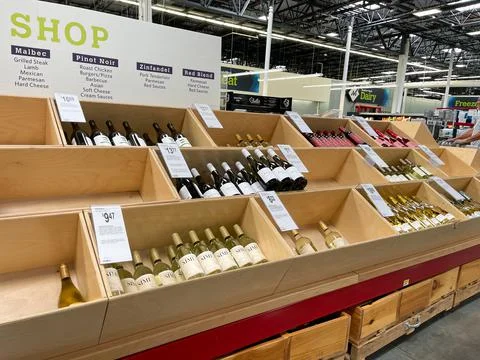 Rows of different types of wines and champagne at a Sam's Club grocery store. Stock Photos