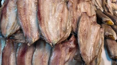 Rows of Dried Fish Fillets Displayed at Traditional Asian Market Video stock 329369150