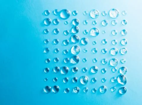 Rows of a drop of water on a blue background in the form of a square Stock Photos