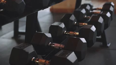 Rows of dumbbells in the gym with sunset light Stock Footage 135331973