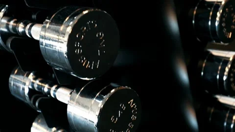 Rows of Dumbbells on Rack in Gym Essential Equipment for Heavy Lifting and Stock Footage 256750131