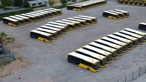 Rows of electric busses aerial view over vehicles parked on industrial site 库存影片 342402946