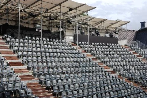 Rows of empty black plastic seats Stock Photos