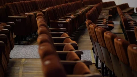 Rows of empty bright spectator seats in an empty hall before the show Stock Footage 274459651