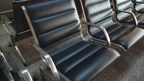 Rows of empty chairs in an airport lounge. Few tourists concept, reduced air  Stock Footage 142750431