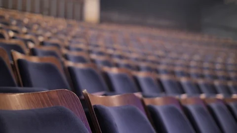 Rows of empty chairs, rack focus of elegant seats in auditorium, theater, Stock Footage