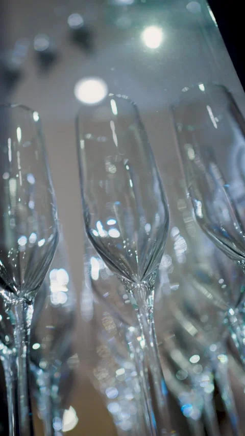 Rows of Empty Champagne Flutes with Elegant Bokeh Background. Soft, warm bo.. Video stock 333915207