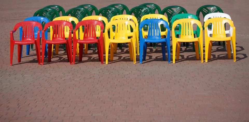 Rows of empty colored chairs Stock Photos