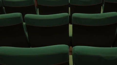 Rows of empty green plush comfortable chairs Stock Footage 295215795