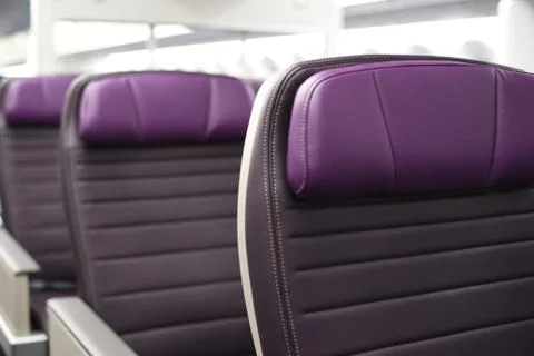 Rows of empty leather airplane seats Stock Photos