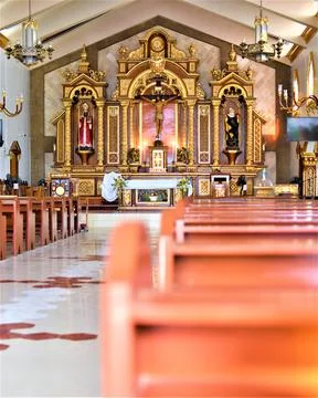 Rows of empty pews inside a Catholic church Stock Photos