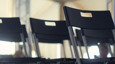 Rows of empty plastic chairs Stock Footage 113496136
