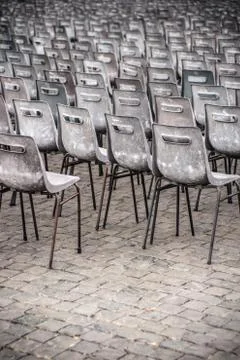 Rows of empty plastic seats, outdoor setting Stock Photos