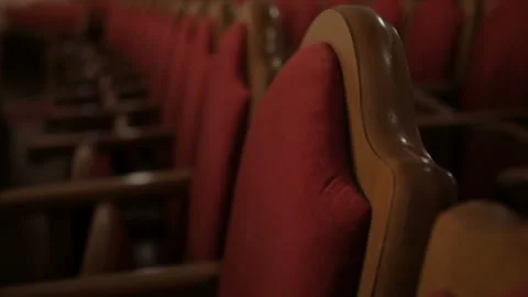 Rows of empty red velvet seats inside a theater or opera. Stock Footage 108386385