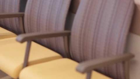 Rows of empty seats in a hospital waiting area Stock Footage 127850328