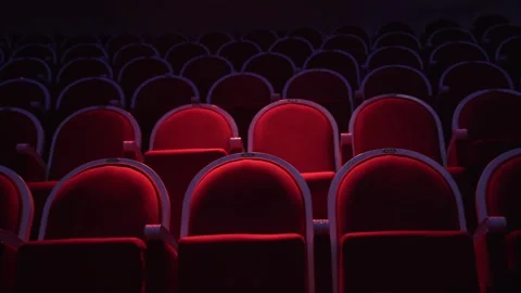 Rows of empty spectator seats in a circus or theater. red upholstered seats for Stock Footage 262570752