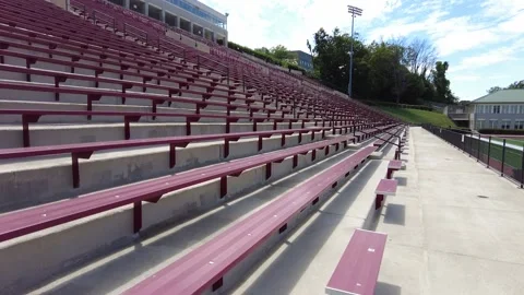 Rows of empty stands in an outdoor stadium Stock Footage 159440188