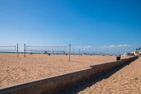 Rows of empty volley ball courts on the sand at the beach Stock Photos