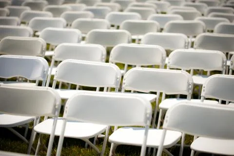 Rows of Empty White chairs Stock Photos
