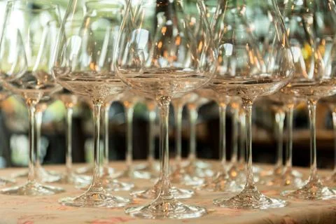 Rows of empty wine glasses on the table Stock Photos