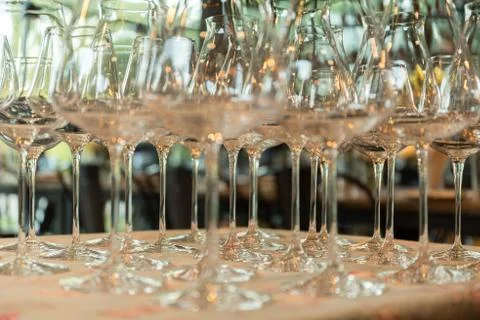 Rows of empty wine glasses on the table Stock Photos