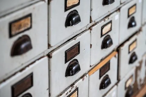 Rows of files and boxes with numbers on them that are marked out Stock Photos