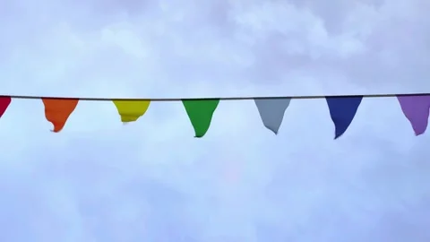 Rows of fluttering triangular flags in a stormy weather. Concept of celebration. Stock Footage 281711597