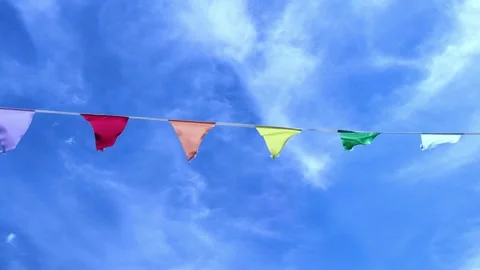 Rows of fluttering triangular flags in a sunny weather on the sky background. Stock Footage 278076511