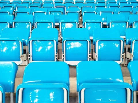 Rows of folded blue chairs 스톡 사진