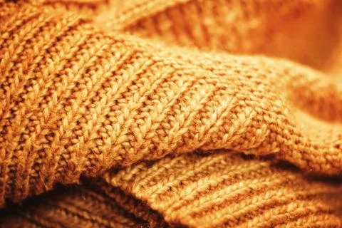 Rows of folded woolen product large knitted Stock Photos