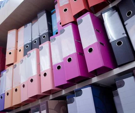 Rows of folders for bookkeeping lie on a shelf 写真素材