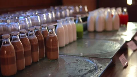 Rows of Fresh Chocolate and Milk Bottles Displayed on Beverage Production L.. Stock Footage 341654926