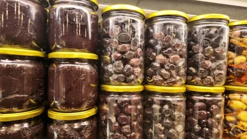 Rows of Glass Jars Filled with Olives and Olive Paste on Supermarket Shelves Video stock 342807821