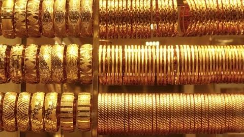 Rows of gold bracelets and rings 動画素材 333889784