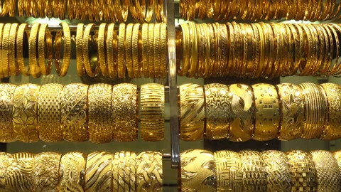 Rows of gold bracelets Stock Footage 141871492