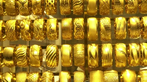 Rows of gold bracelets i Stock Footage 113352794