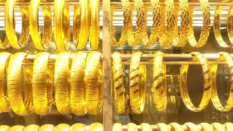 Rows of gold bracelets in a store on the Grand Bazaar Stock Footage 86197991