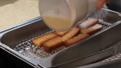 Rows of Golden Fried Crispy Fish Sticks on a Wire Rack Stockbeeldmateriaal 333569714