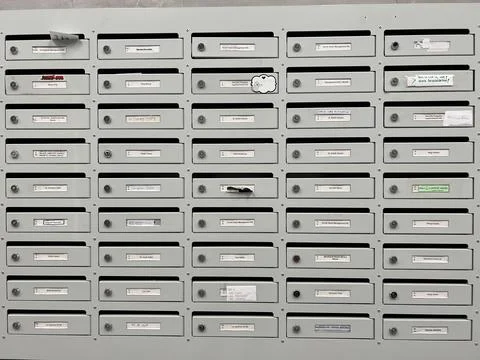 Rows of gray metal mailboxes. Close-up Stock Photos