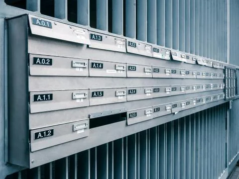 Rows of gray post boxes on the street in Brussels Stock Photos
