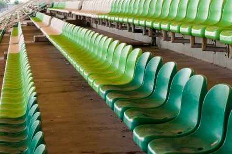 Rows of green seats in stadium Stock Photos