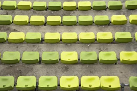 Rows of green seats in stadium Stock Photos