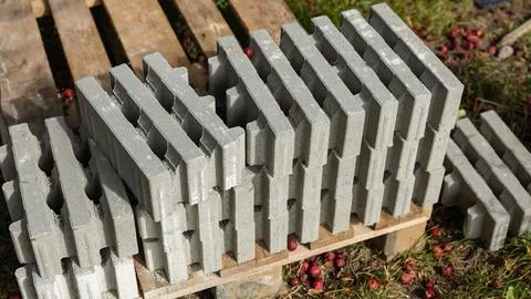 Rows of Grey Concrete Blocks Stacked on Wooden Pallet Stock Photos