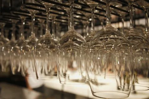 Rows of hanging wine glasses Stock Photos