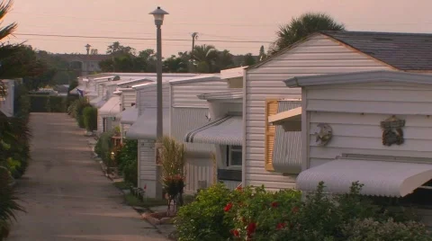 Rows of homes near a walking path at a trailer park. Stock Footage 553483