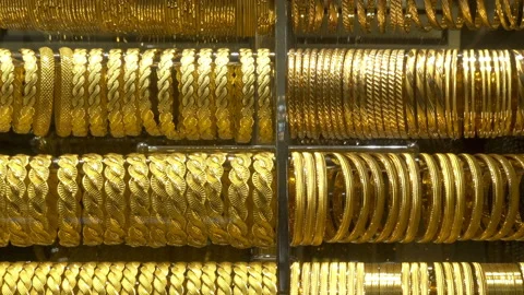 Rows of jewelry gold bracelets Stock Footage 164284608