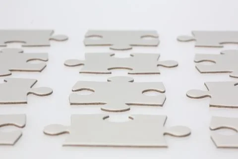 Rows of jigsaw puzzle pieces Stock Photos