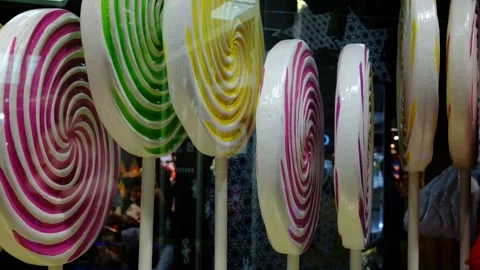 Rows of large colorful spiral lollipops Stock Footage 328638341